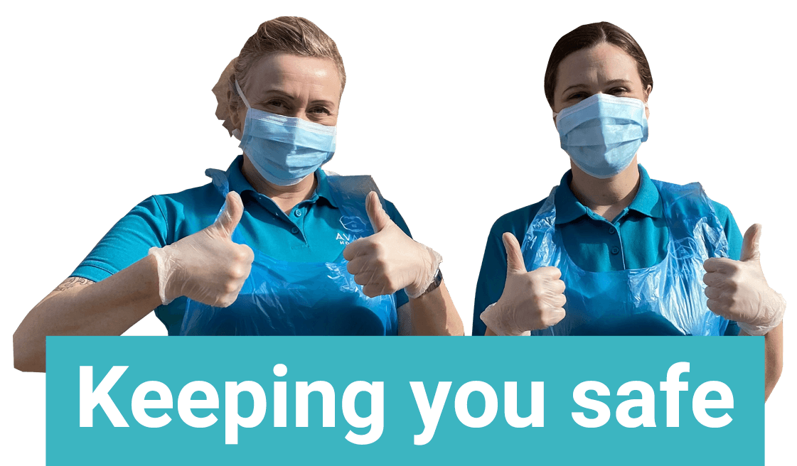 keeping_you_safe Avanti Homecare staff demonstrating the PPE, including Aprons masks and gloves they are wearing to keep people safe.